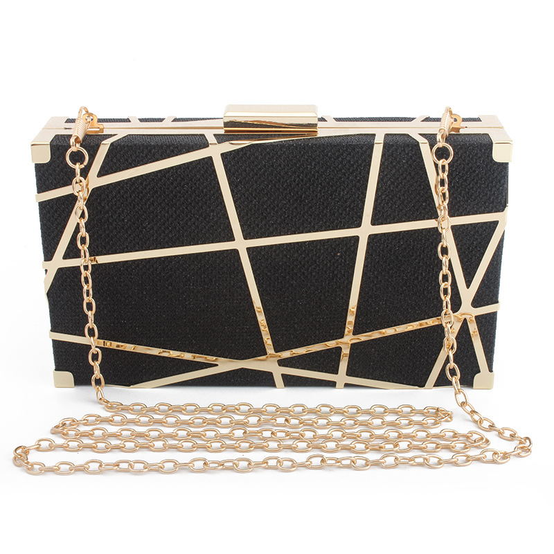 Women's Crystal Mesh Cage Clutch - Black Crystal The perfect addition to any look, this mini paper-bag style clutch features an exaggerated chain detail and adjustable strap in a soft leather fabrication.