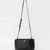 Candid Crossbody Bag, Black The perfect addition to any look, this mini paper-bag style clutch features an exaggerated chain detail and adjustable strap in a soft leather fabrication.